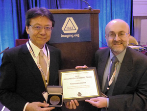 image:Dr. Yoshihiko Hotta holding the award plaque and the engraved medal with IS&T President Dr. Alan Hodgson