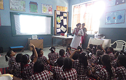 image:A teacher asking questions to pupils using projected images