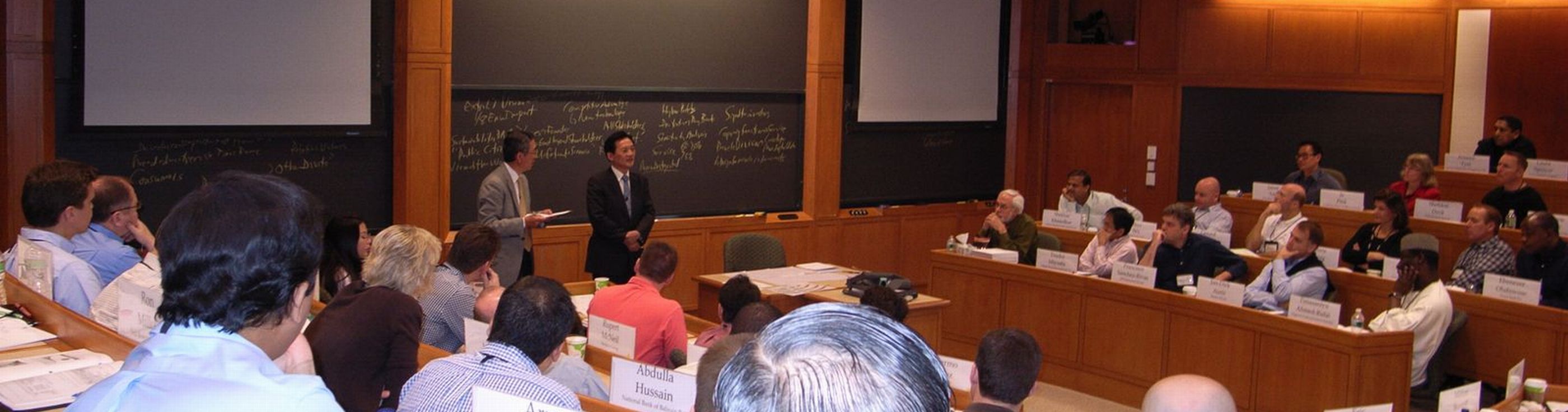 Mr . Tani answers questions at the HBS class.