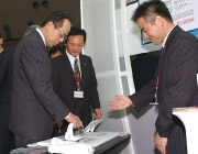 Prime Minister Fukuda erasing the written letters with an iron